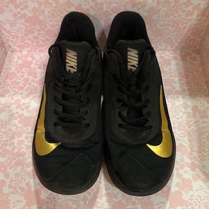 Nike black and gold shoes excellent used condition